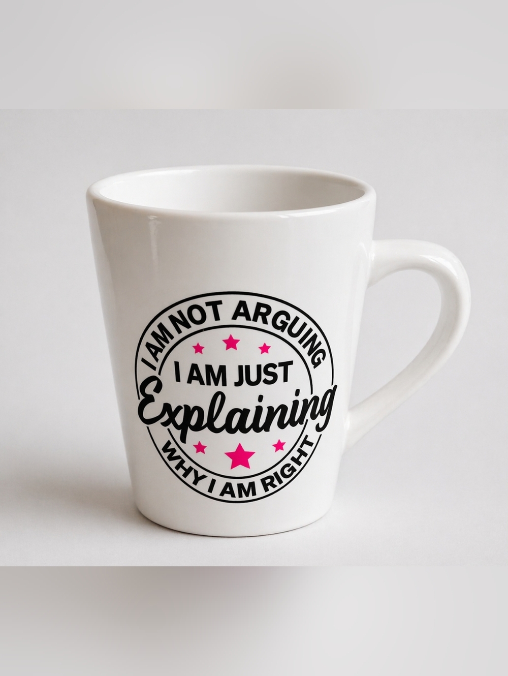 White Ceramic Mug with Black Script and Pink Stars - Just Explaining